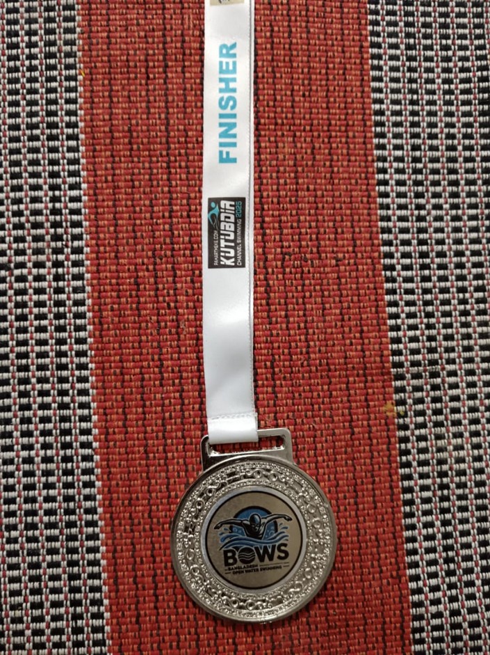 Finisher medal from Kutubdia Channel Swimming 2025